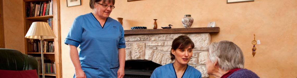 Nurses speaking to a patient